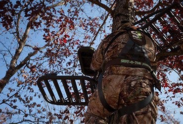 Hunter Climbing Tree Stand with Summit Seat-O-The-Pants STS Fastback Harness On 