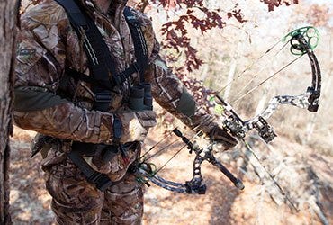 Bow Hunter in Tree Stand 