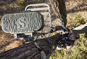 Man Climbing to Tree Stand 