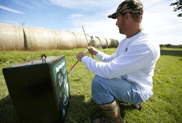 Man Practicing with Bow Outside 