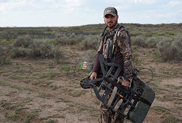 Man Preparing to Set Up Tree Stand 