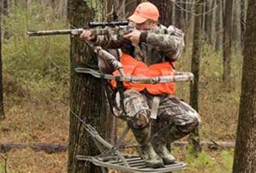 Man Hunting From a Tree Stand 