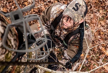 Hunter Preparing to Climb Treestand