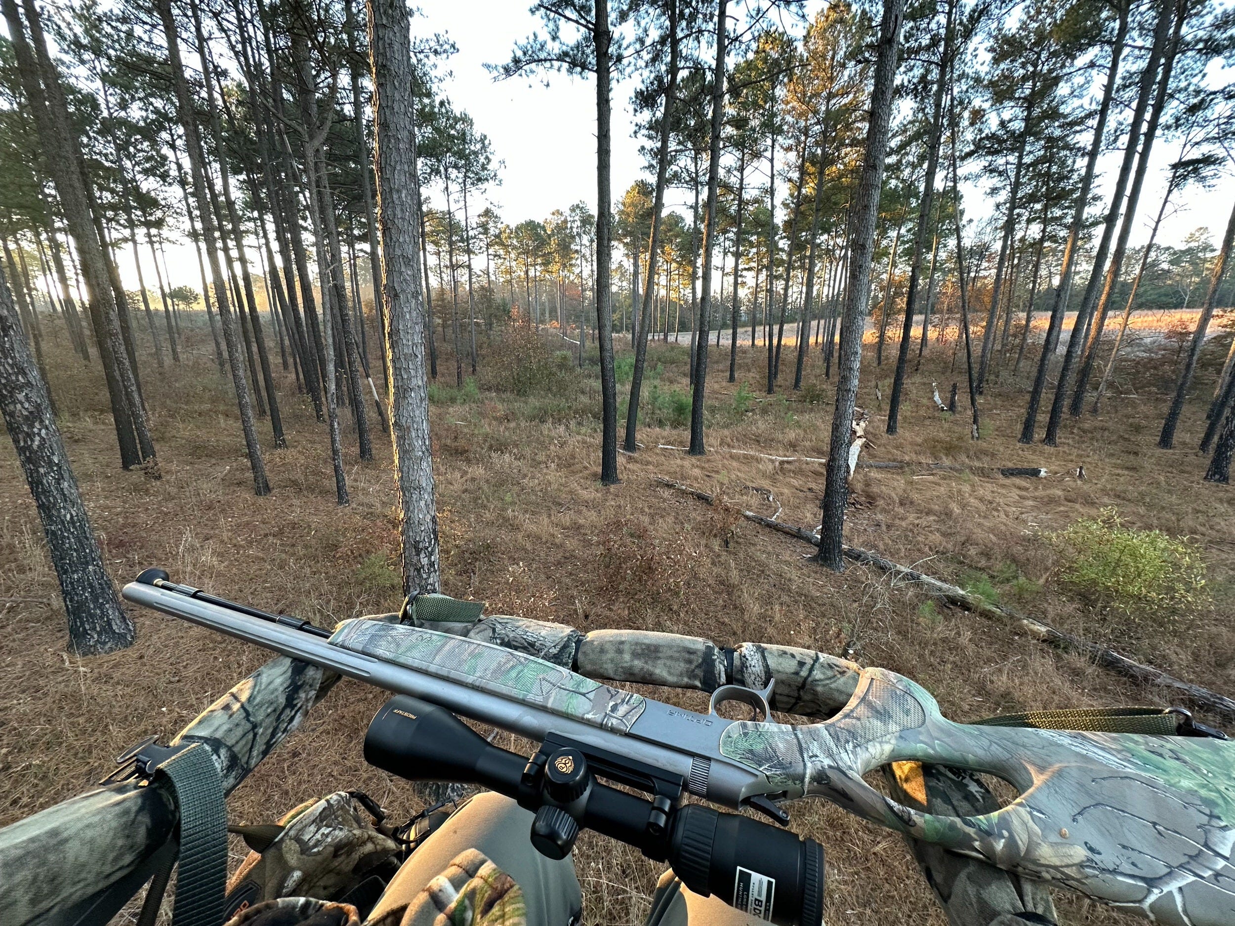Photo from Brian V. sitting in his Summit climber with gun resting on seat frame. Winner of the 2024 View From Your Summit Sweepstakes.